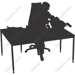 Silhouette of a Person Working at a Desk